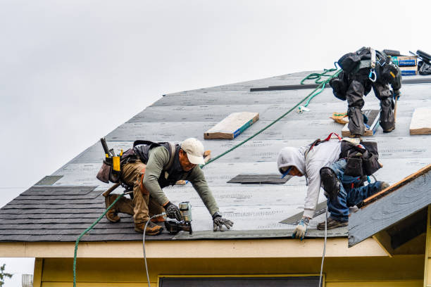 Professional Roofing technician working in Oxford, MA